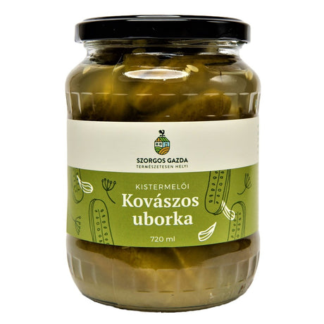 A jar of kovászos uborka, which are Hungarian fermented cucumber pickles.