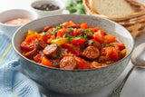 Bowl of lecso Hungarian vegetable stew with slices of smoked kolbasz.