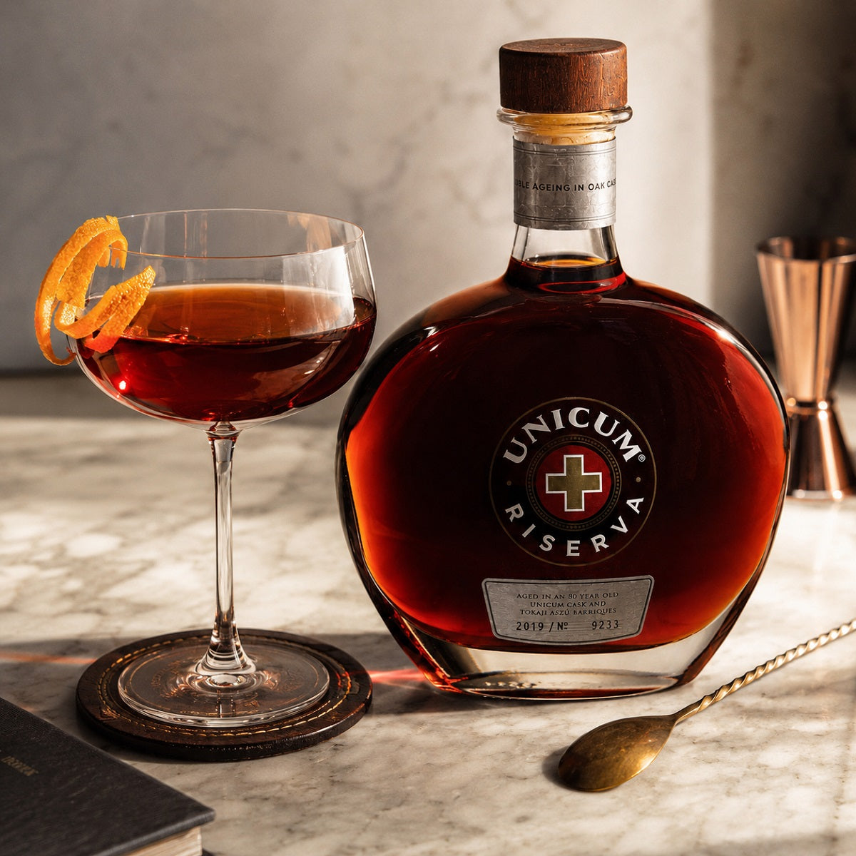 A glass of Manhattan aperitif cocktail made with Zwack Unicum Riserva spirit.