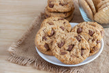 A plate of orange chocolate chip cookies made with candied orange peel and Belgian dark chocolate chips.