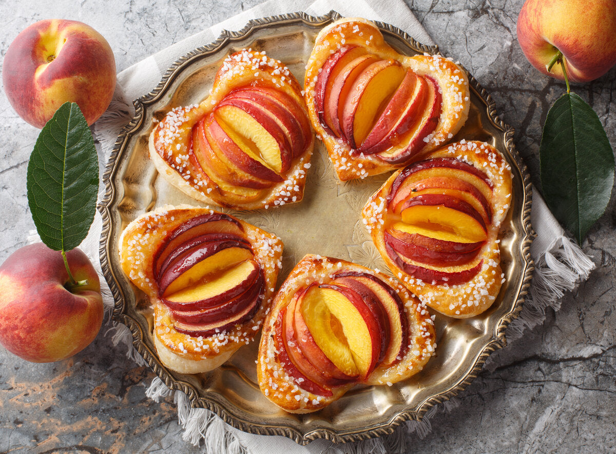 Peach puff pastry hearts made with fresh peaches and peach jam.