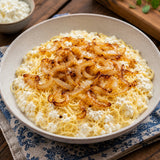 Dish of Polish cottage cheese pasta with kluski noodles, sour cream and caramelised onions.