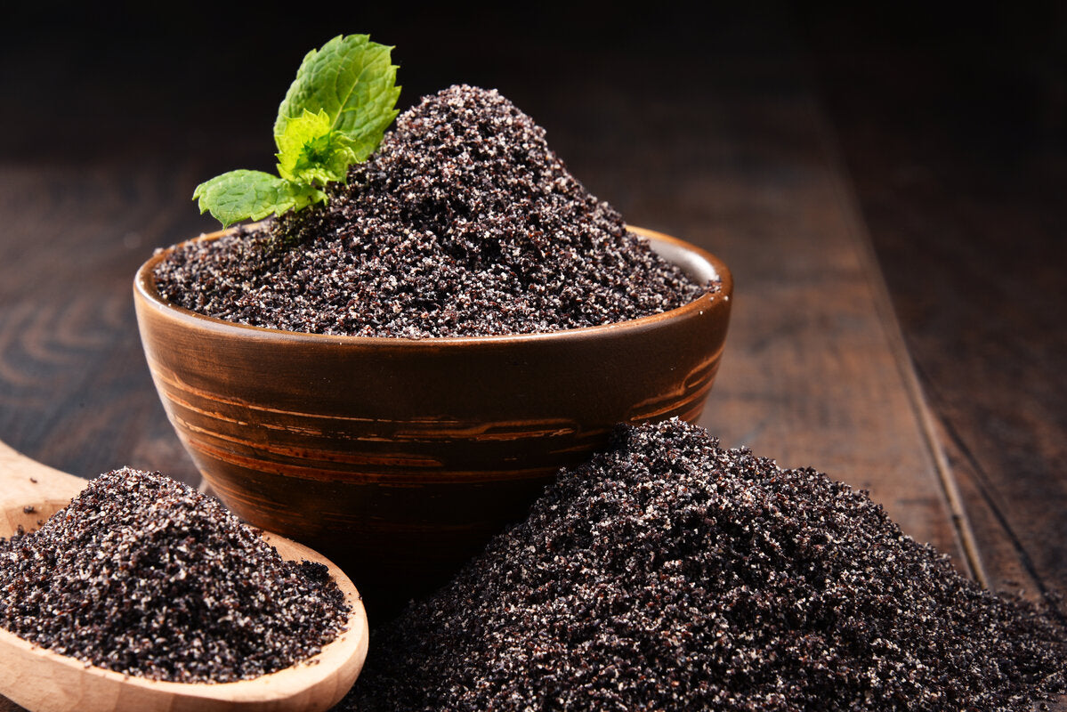 A bowl of poppy seed flour, a gluten-free ingredient for baking.