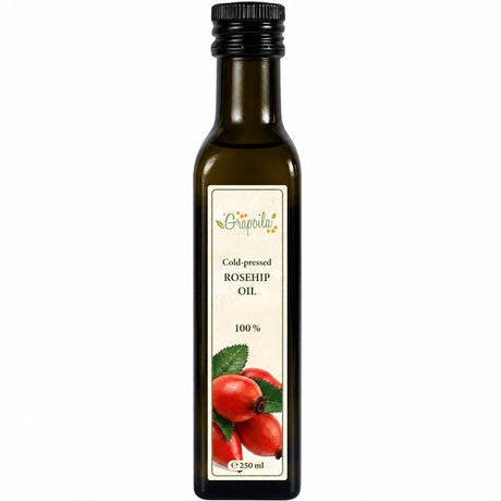 Bottle of cold-pressed rosehip oil on a white background.
