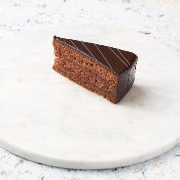 A piece of Sachertorte, made using an original Austrian Sacher cake recipe.