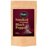 A packet of smoked ground black pepper spice.