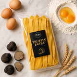 A pack of truffle pasta showing the ingredients used, including eggs, flour, and truffles, on a marble surface