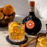 A glass of cocktail made made with Zwack Unicum Orange Bitter.