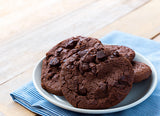 Dairy-free and vegan double chocolate chip cookies on a white plate.