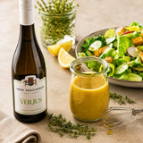 Healthy salad dressing made with verjus, olive oil and mustard.
