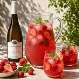Pitcher of verjus drink, this fruit cordial is made with a bottle of verjuice, strawberries and raspberries.