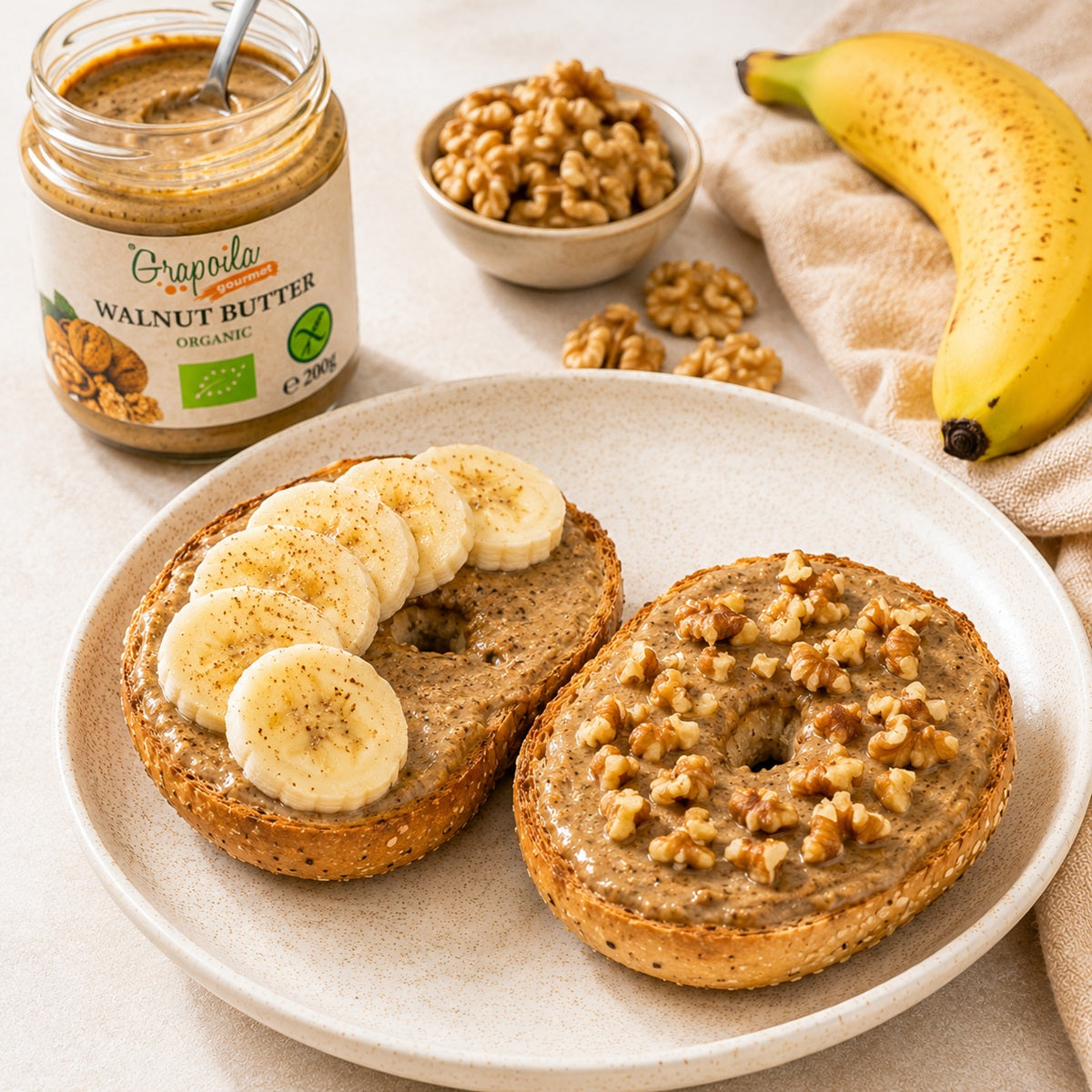 Creamy walnut butter spread over bagels, topped with fresh walnuts and banana slices.