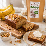 Banana and walnut bread baked with ground walnut flour on a wooden board.