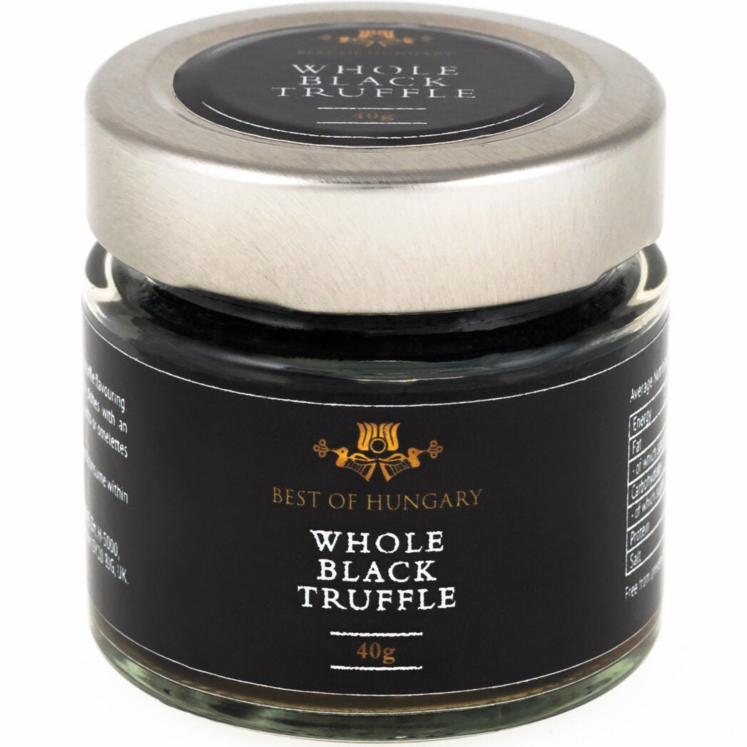 A jar of whole black truffle, made by preserving black summer truffle pieces.