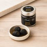 Whole pieces of black summer truffles in their own juice.