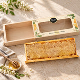Open wooden Acacia Honeycomb Frame gift box with its sliding lid and full raw honeycomb frame.