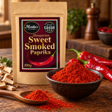 Hungarian Sweet Smoked Paprika pouch with a bowl and spoonful of vivid smoked paprika powder.