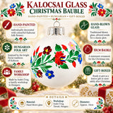 Kalocsai glass Christmas bauble infographic showing hand-painted Hungarian folk flowers and hand-blown glass.