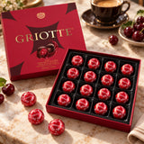 Open Kraš Griotte box with 16 individually wrapped sour cherry chocolates and coffee.