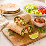 Gluten-free tortilla wraps made with ground flaxseed flour, filled with avocado, chicken, and vegetables.