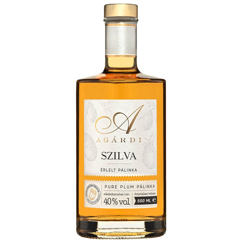 A bottle of premium Hungarian plum pálinka aged in an oak barrel. 
