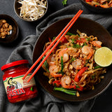 A spicy Asian seafood stir-fry recipe made with Erős Pista hot pepper sauce.