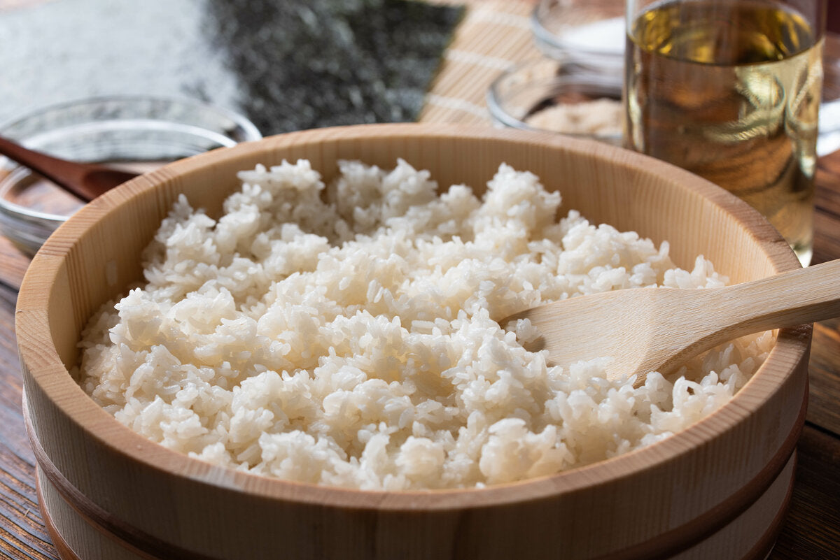 A bowl of Japanese sushi rice with vinegar seasoning.