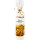 A bottle of Tokaji Sárgamuskotály late harvest wine in gift packaging from the Muscat Lunel grape variety by Tokajicum.