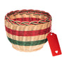An empty wicker hamper basket in a red, white and green for Christmas gifts.